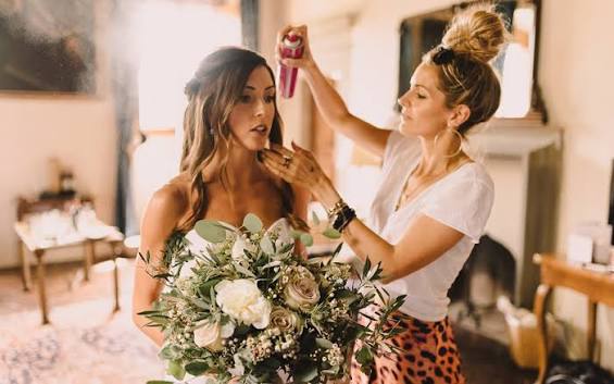Gemma styling a bride's hair on her wedding morning